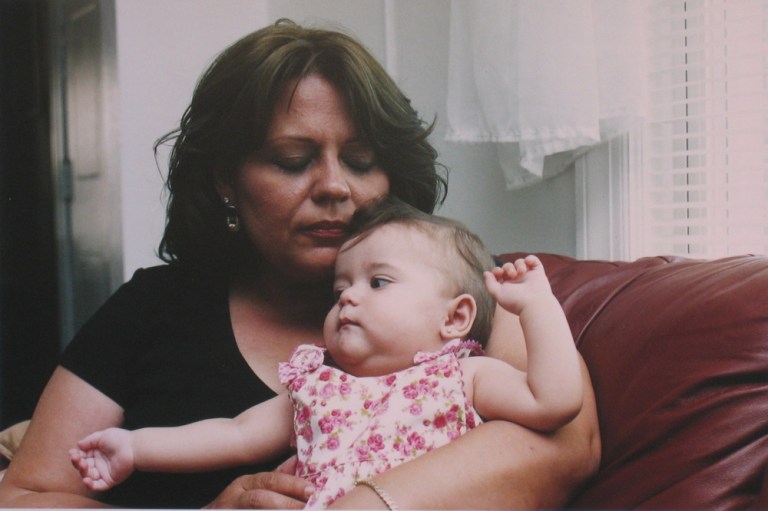 Lynn & granddaughter, by Paul Calhoun